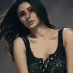 Mouni Roy looked glamorous in a black top and golden skirt