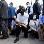 Canadian PM sitting on his knees in front of Parliament