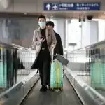 China suspends entry by foreign nationals curb imported Covid-19