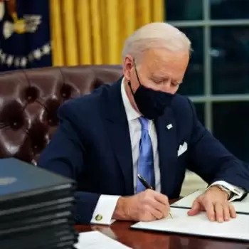 Biden rolls back Trump policies on wall, climate, health, Muslims