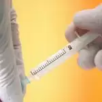 Vaccinated U.S. nurse contracts COVID-19