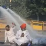 Farmers break barricades go through water cannons to continue Delhi march