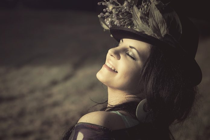 woman smiling looking up