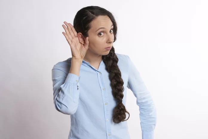 woman showing her ear