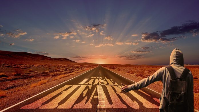 person walking on the road