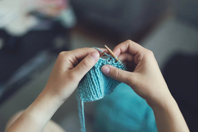 a person is knitting