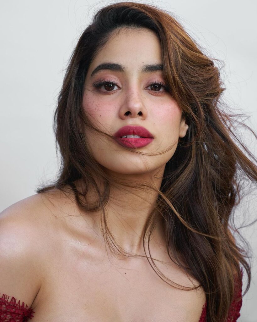 Janhvi Kapoor looking stunning in a dazzling red dress, capturing her elegant style.