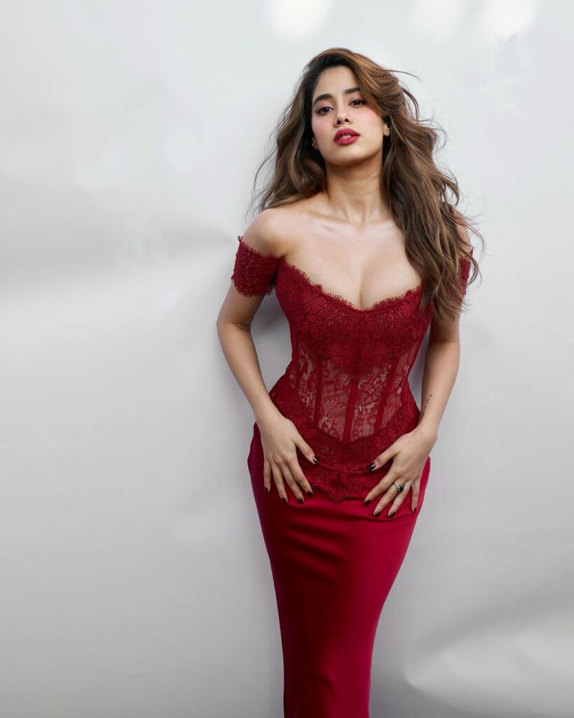 Janhvi Kapoor looking stunning in a dazzling red dress, capturing her elegant style.